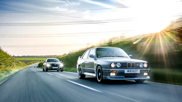 Two BMW M cars on the road