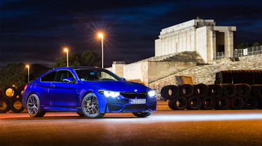 A blue BMW M parked