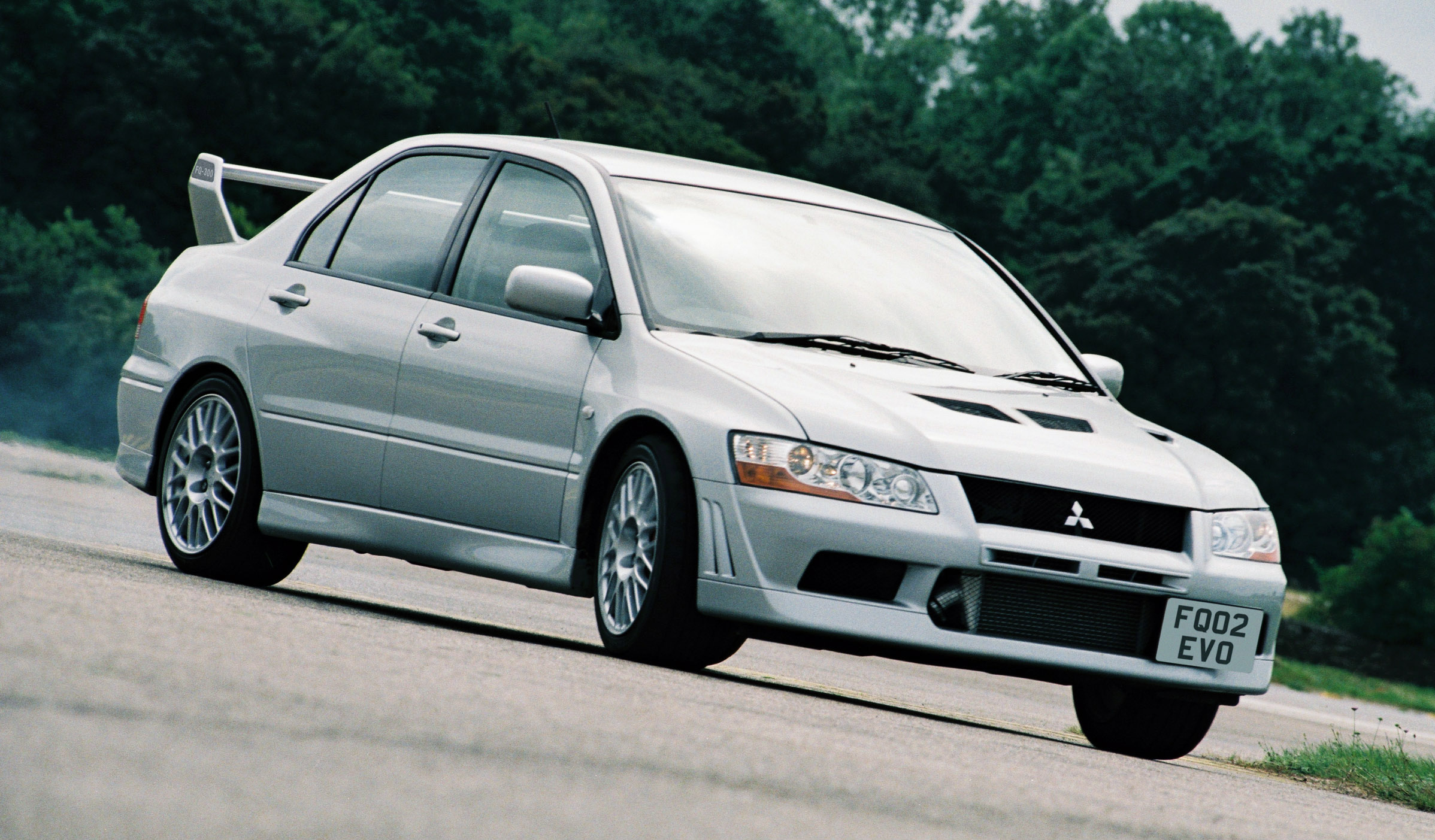 Mitsubishi Lancer Evolution VII - press shot yellow