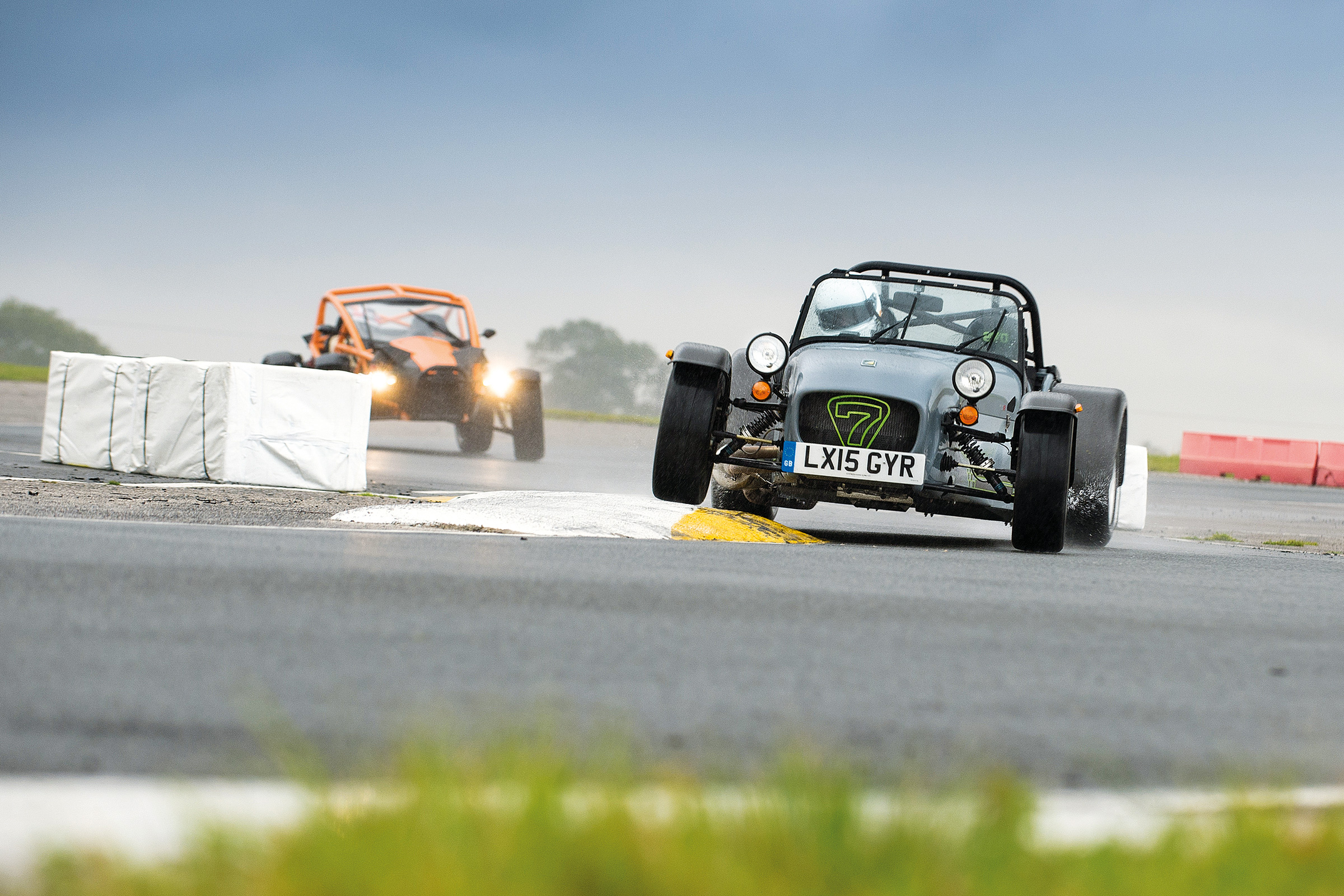 Ariel Atom and Caterham on track. 
