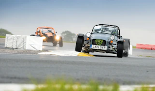 Ariel Atom and Caterham on track.