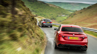 BMW M3 Competition Package & Alfa Romeo Giulia Quadrifoglio – rear on road
