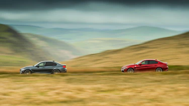 BMW M3 Competition Package & Alfa Romeo Giulia Quadrifoglio – side on road