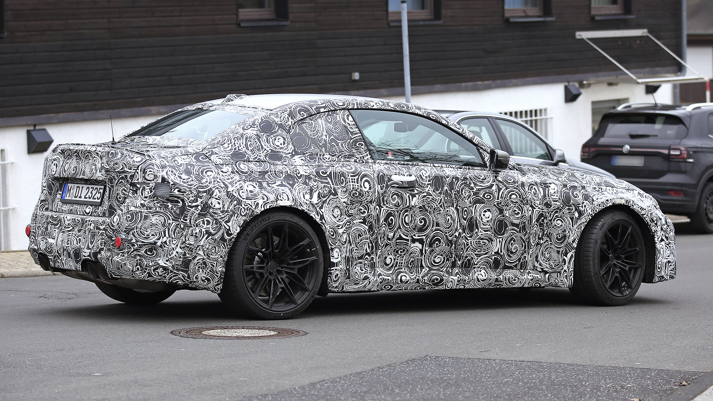 2022 BMW M2 spied road rear quarter