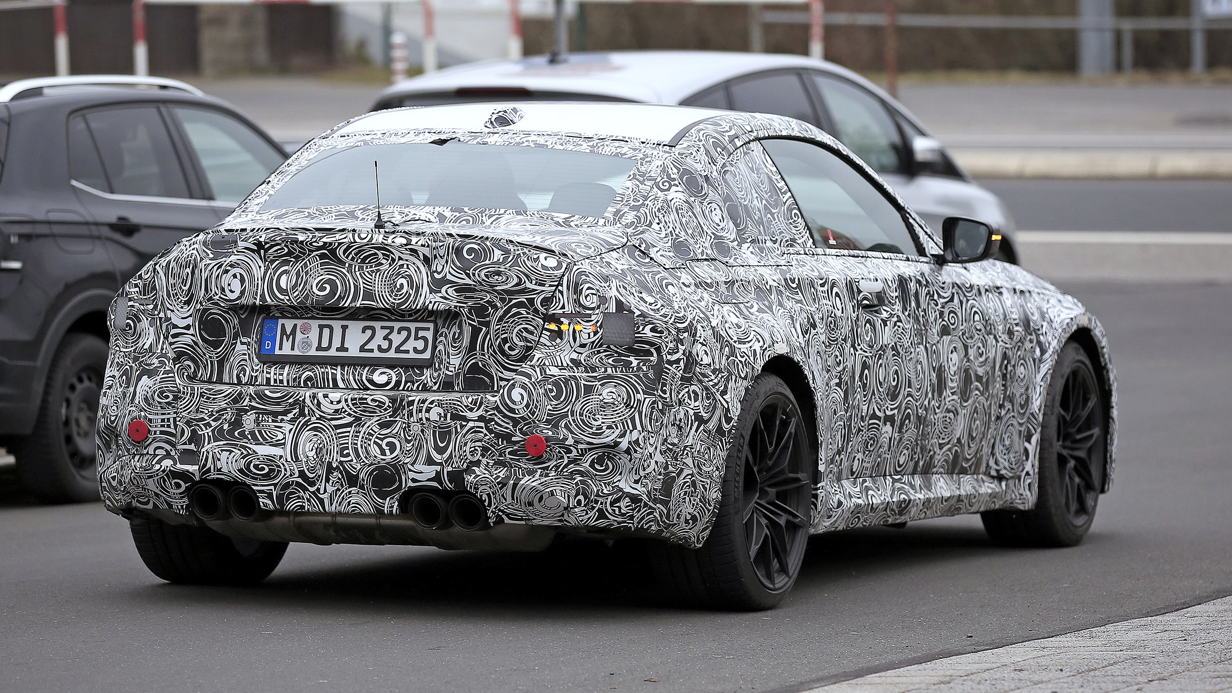 2022 BMW M2 spied road rear quarter