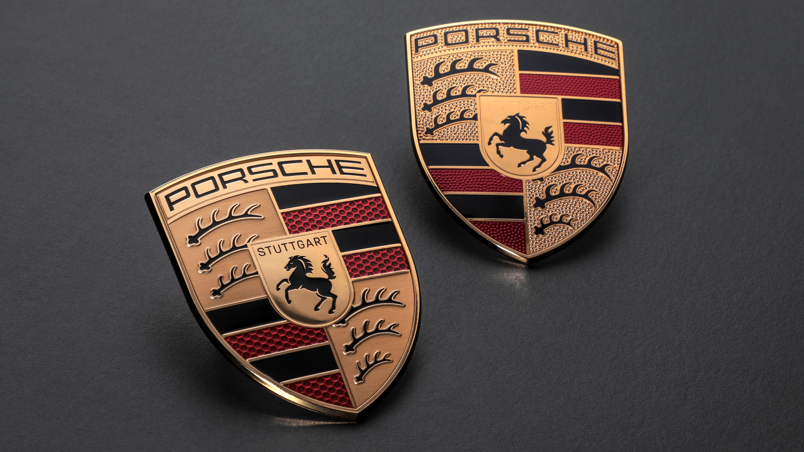 Old and new Porsche logos