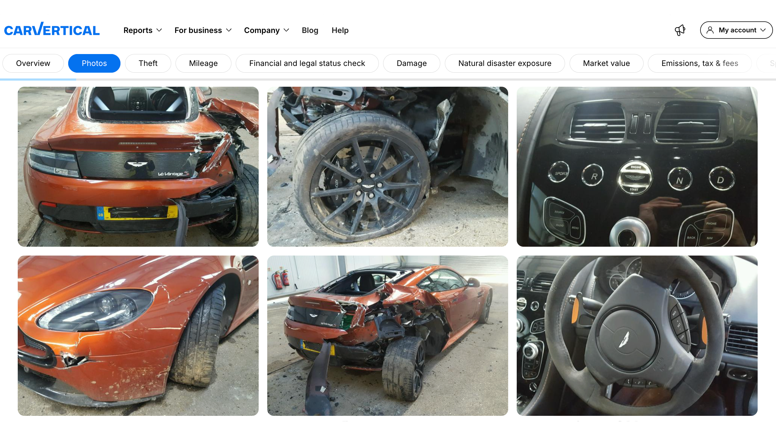 Photo section in the carVertical report showing a damaged Aston Martin Vantage