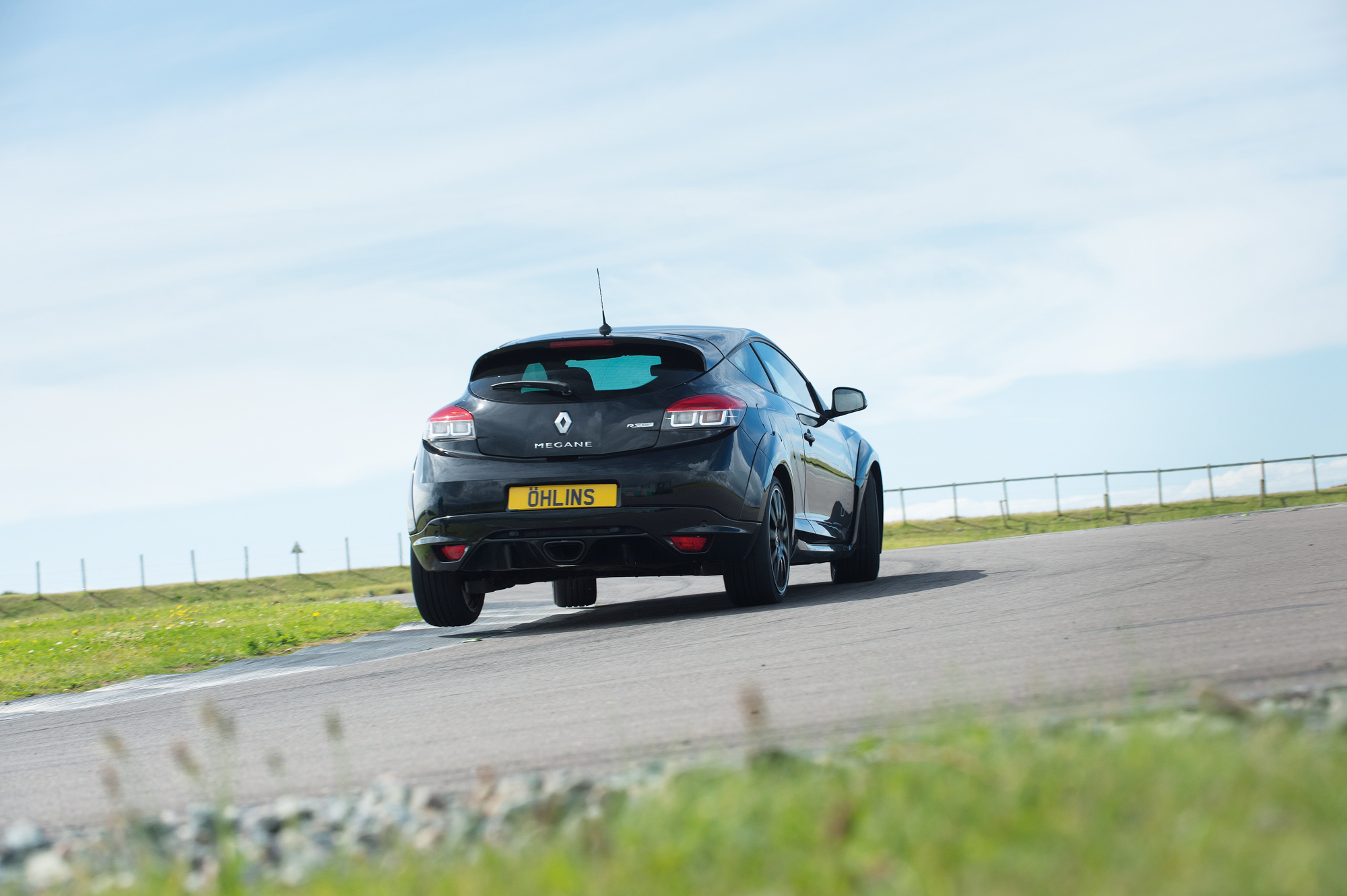Our black test car sits on Öhlins dampers