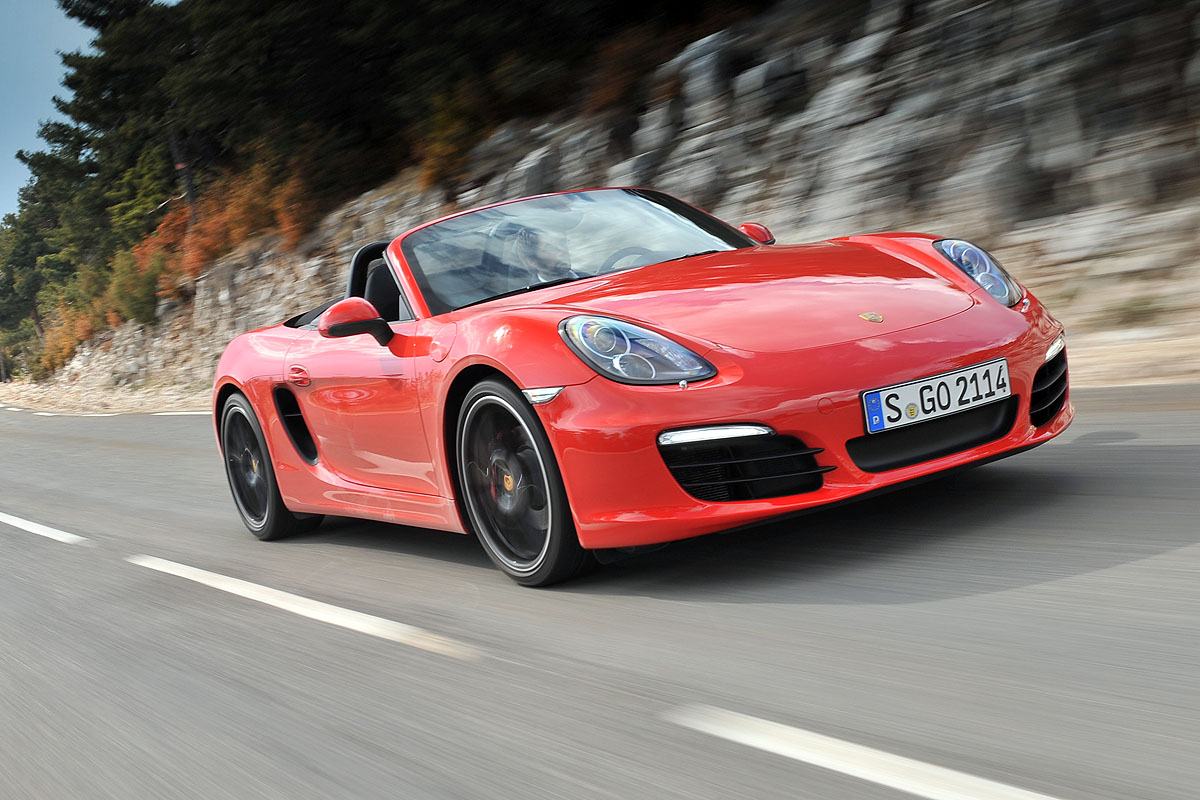 Porsche Boxster S driving, red with black wheels