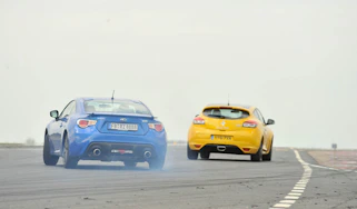 Subaru BRZ coupe and Renaultsport Megane 265 Trophy on track