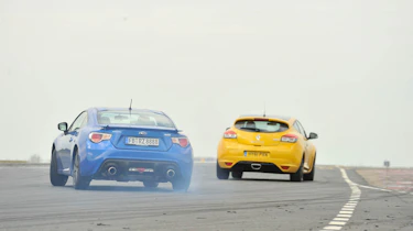 Subaru BRZ coupe and Renaultsport Megane 265 Trophy on track