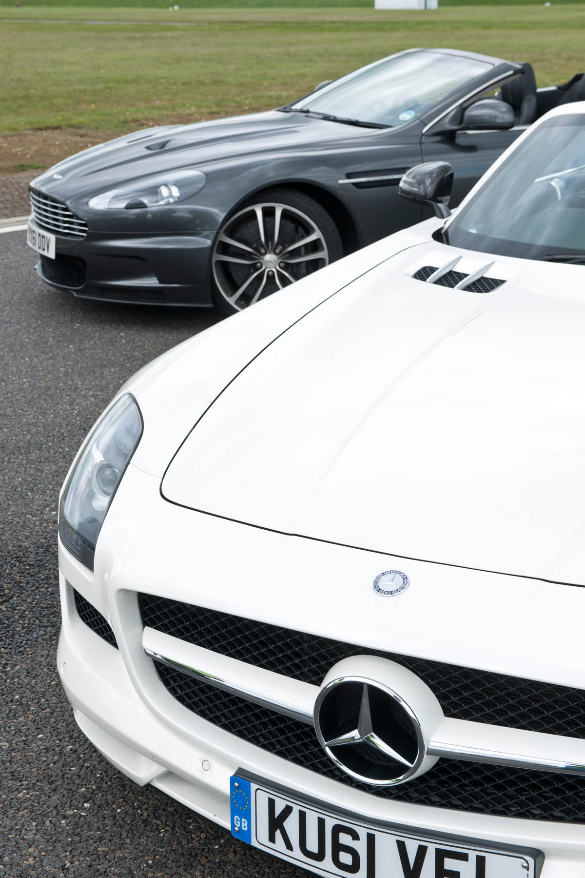 Mercedes SLS AMG Roadster vs Aston Martin DBS Volante evo track battle