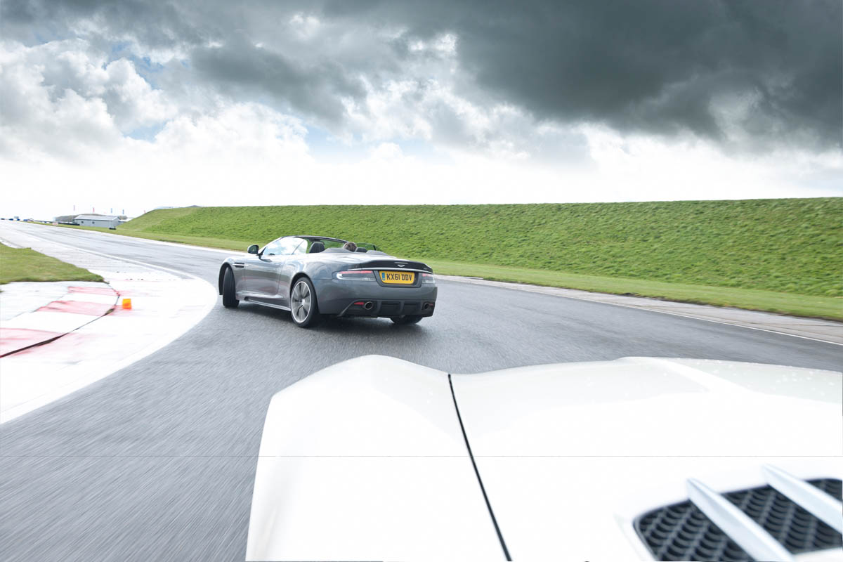 Mercedes SLS AMG Roadster vs Aston Martin DBS Volante evo track battle