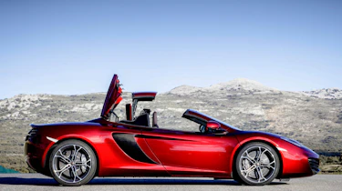 McLaren MP4-12C Spider volcano red roof in action roof opening