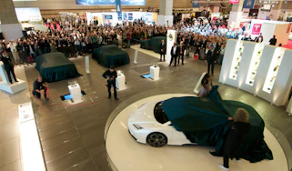 Lotus 2010 Paris motor show Brian May Naomi Campbell