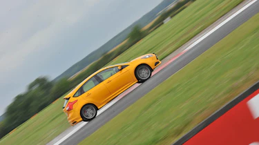 2012 Ford Focus ST orange on track