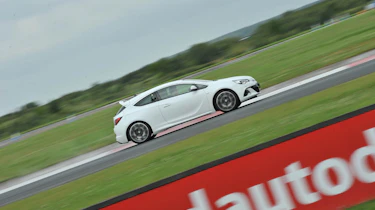2012 Vauxhall Astra VXR white on track