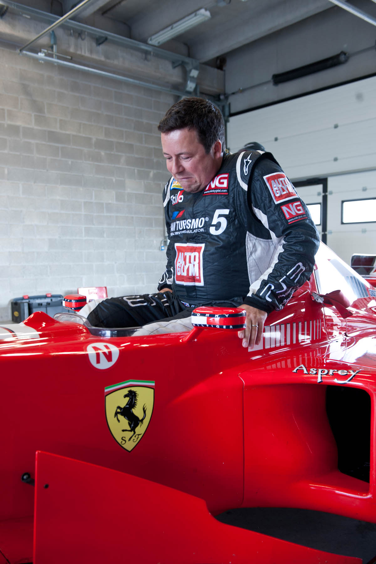 Michael Schumacher's Ferrari F1 car Richard Meaden climbs in