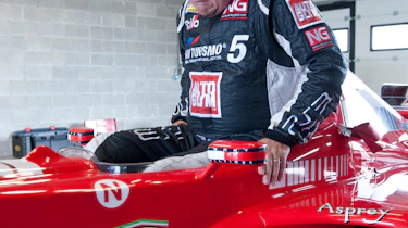 Michael Schumacher's Ferrari F1 car Richard Meaden climbs in