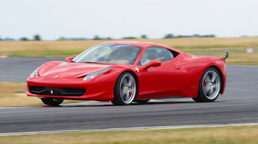 Red Ferrari 458 Italia sliding on track
