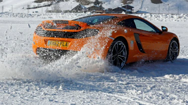 McLaren MP4-12C orange on snow
