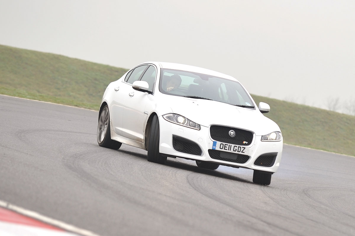 Jaguar XFR white, drifting on track