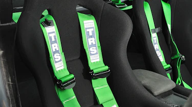 Revolution Project STI Nurburgring Subaru Impreza front seat green harnesses