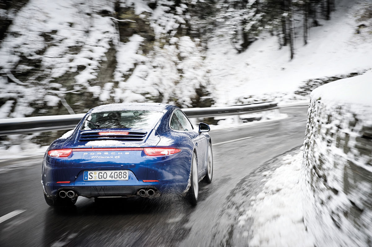 Porsche 911 Carrera 4S rear cornering shot in the snow