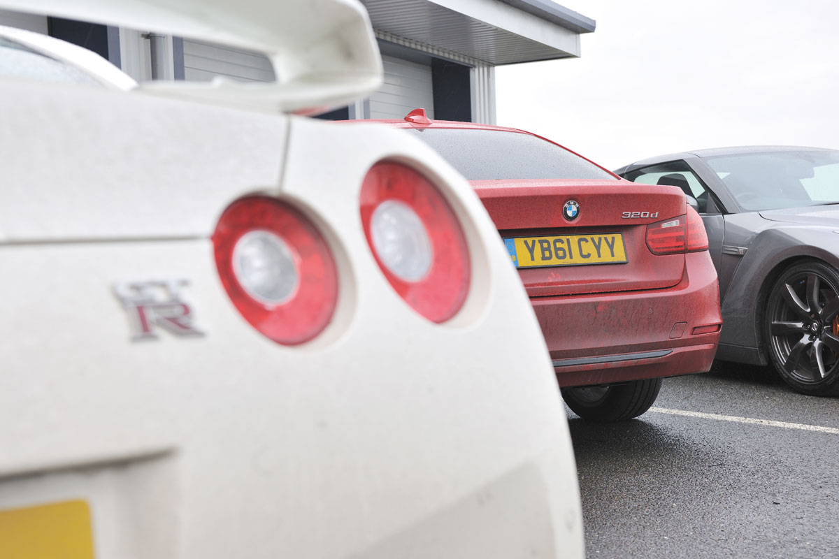 BMW 320d rear badge, with Nissan GT-R at Bedford Autodrome
