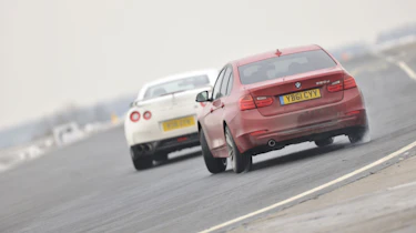 BMW 320d sideways drift on track red f30