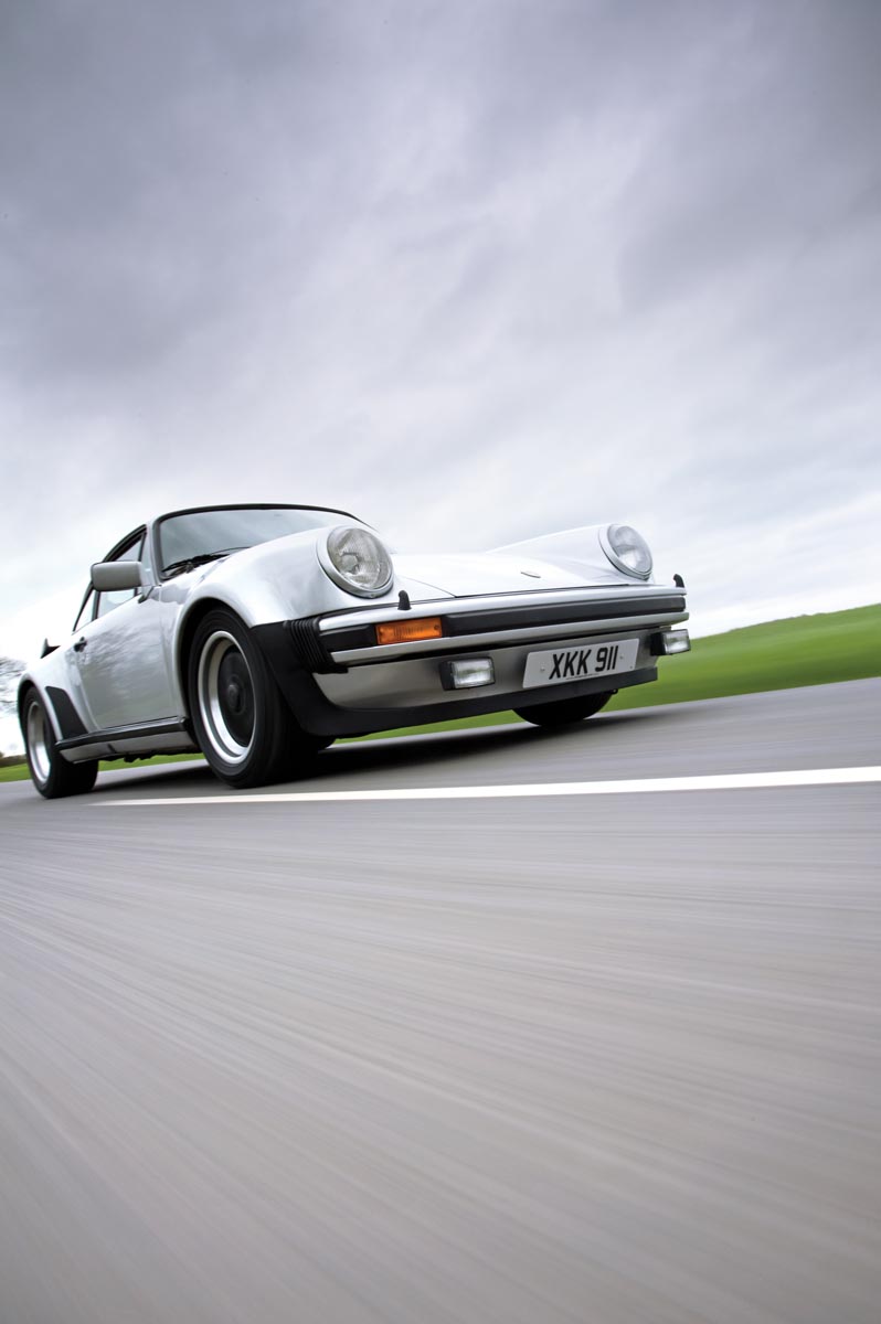 Porsche 911 turbo front quarter driving silver