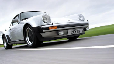 Porsche 911 turbo front quarter driving silver