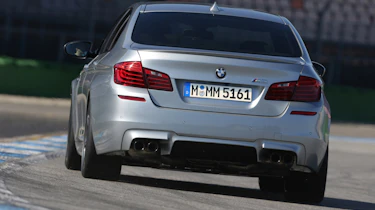 BMW M5 2013 rear cornering, on track