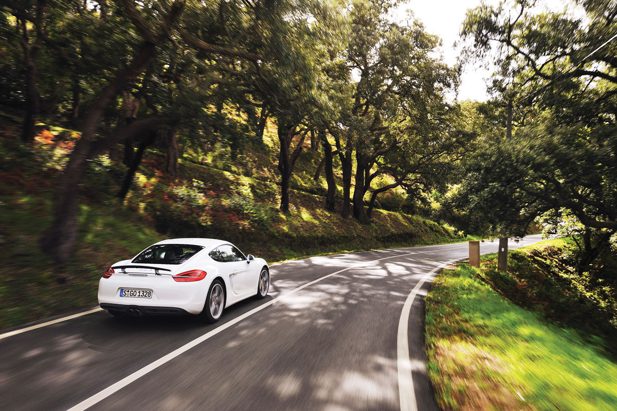 Porsche Cayman S 2013 rear, white, on the road in Portugal