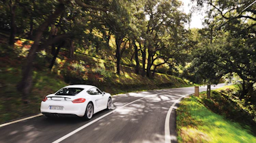 Porsche Cayman S 2013 rear, white, on the road in Portugal