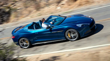 Aston Martin Vanquish Volante blue side profile roof down