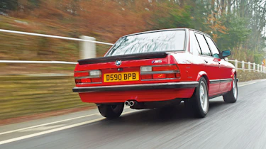 BMW M5 E28 red, rear driving picture