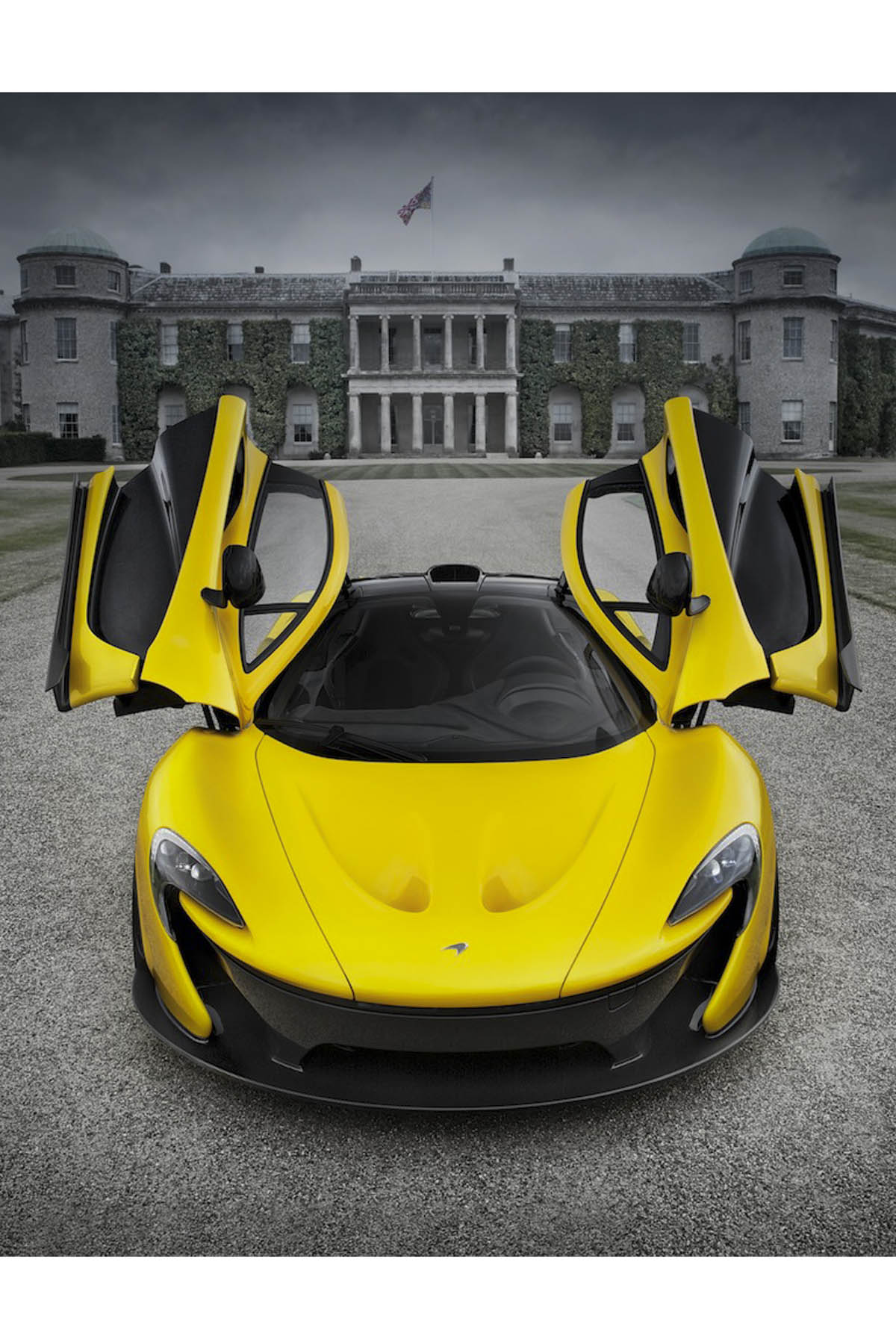 McLaren P1 doors up Goodwood house