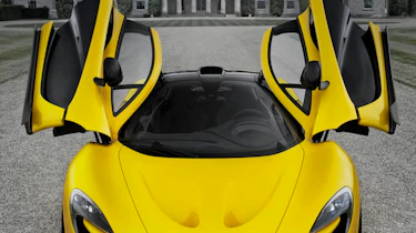 McLaren P1 doors up Goodwood house