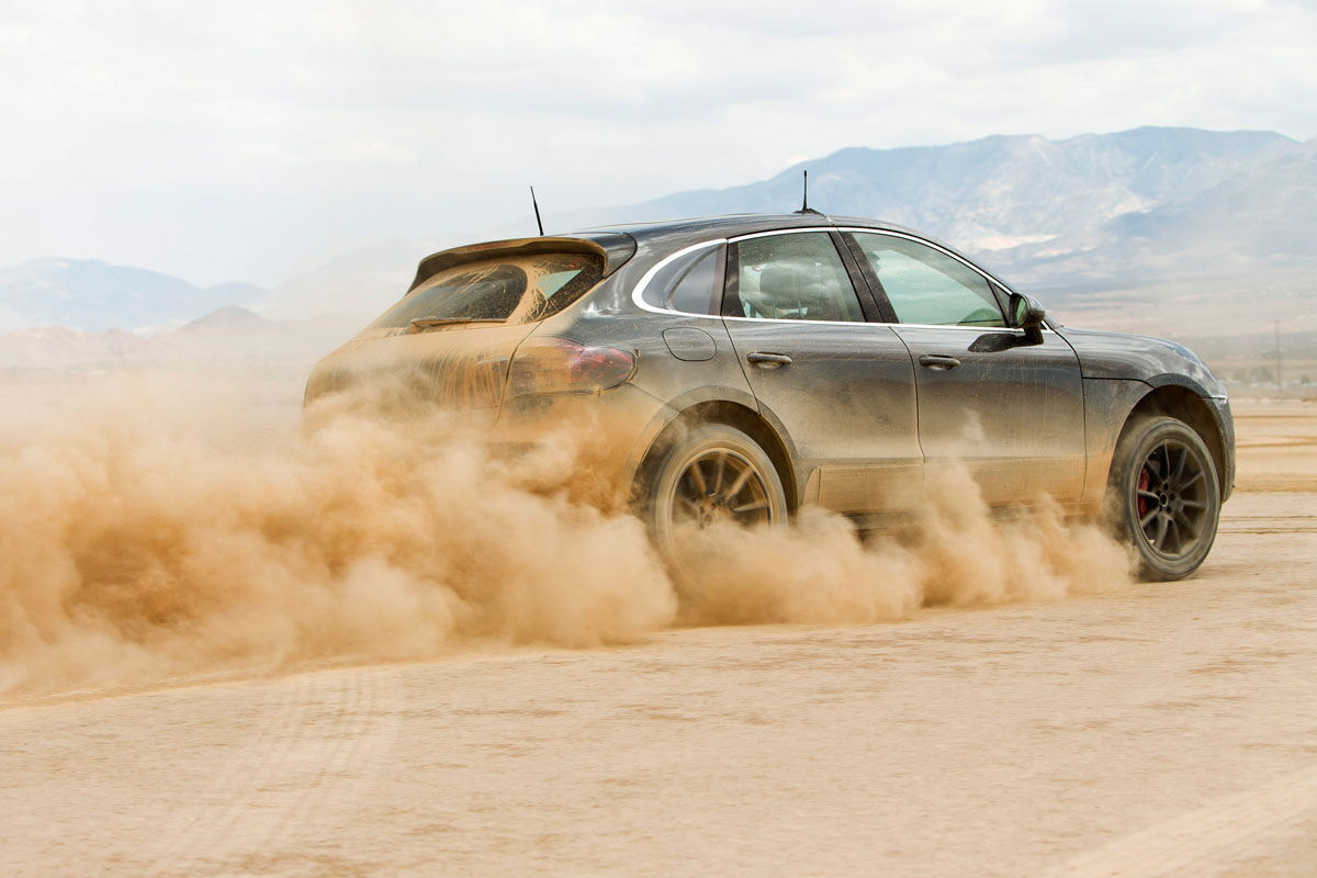 Porsche Macan SUV dust trail