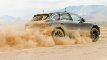 Porsche Macan SUV dust trail