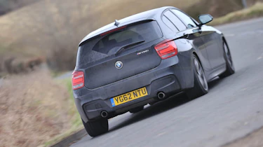 BMW M135i black five-door slide