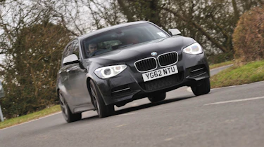 BMW M135i black five-door drift