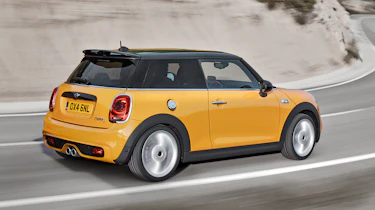 2014 Mini Cooper S yellow driving