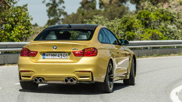 New BMW M4 yellow rear