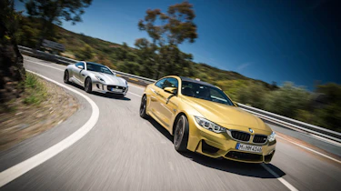 evo Magazine July 2014 - BMW M4 vs Jaguar F-type Coupe