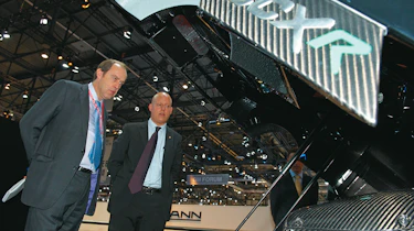 Harry Metcalfe (R) talks to Christian von Koenigsegg