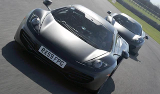 McLaren MP4-12C supercar by Button and Hamilton