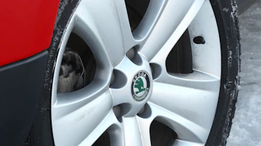 Skoda Yeti meets Lotus Evora in snow
