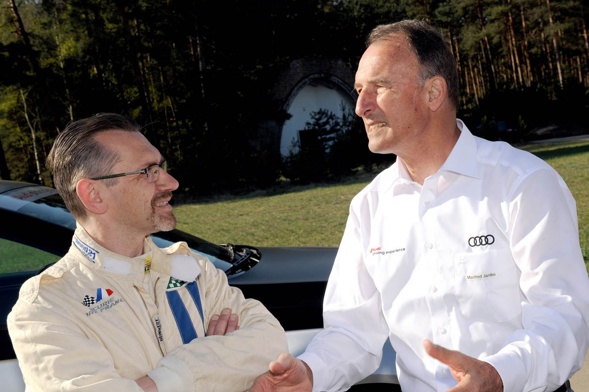 evo races an Audi R8 LMS at the Nurburgring 24 hours